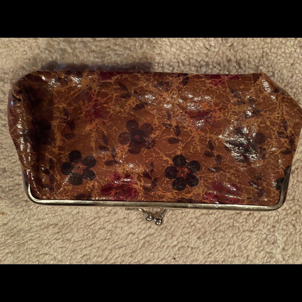 Brown flower clutch’s new condition.